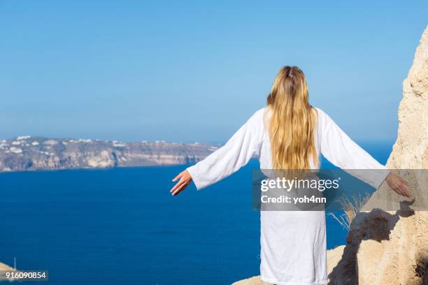 spiritual morning & woman in bathrobe - jesus is alive stock pictures, royalty-free photos & images