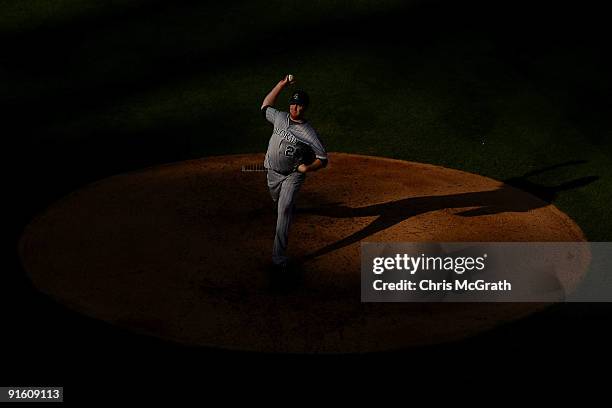 Starting pitcher Aaron Cook of the Colorado Rockies throws a pitch against the Philadelphia Phillies in Game Two of the NLDS during the 2009 MLB...