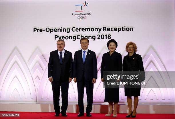 South Korean President Moon Jae-in , his wife Kim Jung-Suk , President of the International Olympic Committee Thomas Bach and his wife Claudia pose...