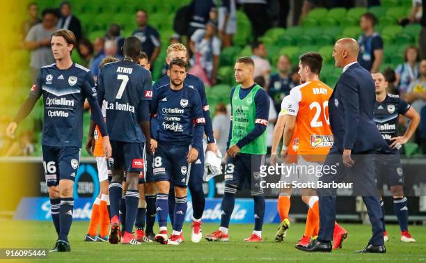 Kevin Muscat, coach of the Victory reacts at the full time whistle as his players shake hands with the Roar during the round 20 A-League match...