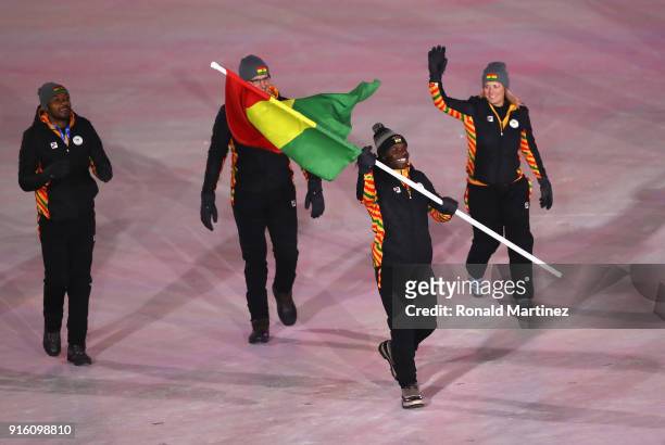 Flag bearer Akwasi Frimpong of Ghana leads the team during the Opening Ceremony of the PyeongChang 2018 Winter Olympic Games at PyeongChang Olympic...