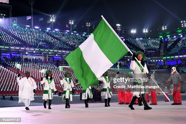 Flag bearer Ngozi Onwumere of Nigeria and teammates enter the stadium during the Opening Ceremony of the PyeongChang 2018 Winter Olympic Games at...