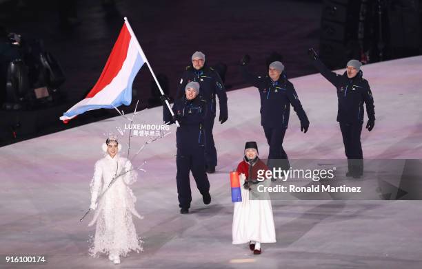 Flag bearer Mattheiu Osch of Luxembourg leads the team during the Opening Ceremony of the PyeongChang 2018 Winter Olympic Games at PyeongChang...