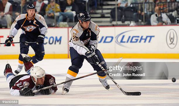 Left wing Steve Sullivan of the Nashville Predators skates past diving defenseman Scott Hannan of the Colorado Avalanche on October 8, 2009 at the...