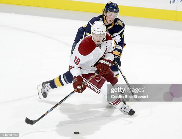 Shane Doan of the Phoenix Coyotes skates ahead of Tim Kennedy of the Buffalo Sabres at HSBC Arena on October 8, 2009 in Buffalo, New York.