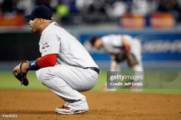 Albert Pujols of the St. Louis Cardinals kneels down at first base against the Los Angeles Dodgers in Game One of the NLDS during the 2009 MLB...