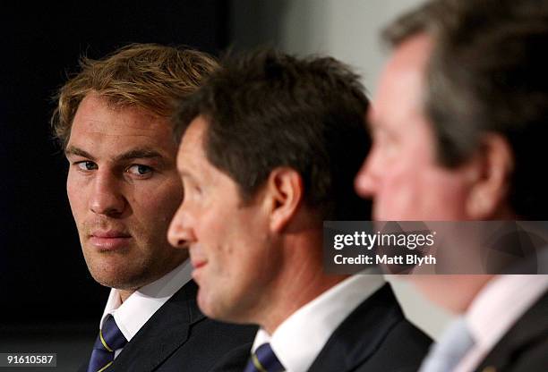 Newly-appointed Wallabies captain Rocky Elsom listens to Wallabies coach Robbie Deans during a press conference to announce the Australian Wallabies...