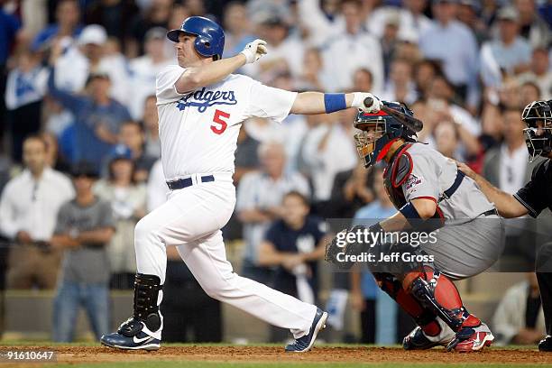 Mark Loretta of the Los Angeles Dodgers hits a walk-off RBI single to center to score Casey Blake to defeat the St. Louis Cardinals in Game Two of...