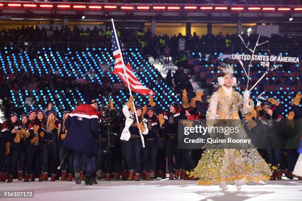 Flag bearer Erin Hamlin of the United States leads the team in the Parade of Athletes during the Opening Ceremony of the PyeongChang 2018 Winter...