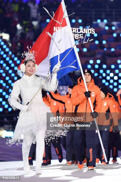 Flag bearer Jan Smeekens of the Netherlands leads his country out during the Opening Ceremony of the PyeongChang 2018 Winter Olympic Games at...