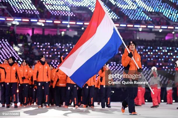 Flag bearer Jan Smeekens of the Netherlands leads his country out during the Opening Ceremony of the PyeongChang 2018 Winter Olympic Games at...