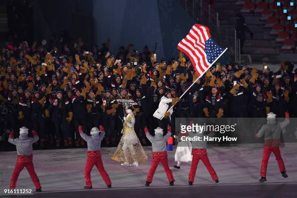 Flag bearer Erin Hamlin of the United States leads the team in the Parade of Athletes during the Opening Ceremony of the PyeongChang 2018 Winter...
