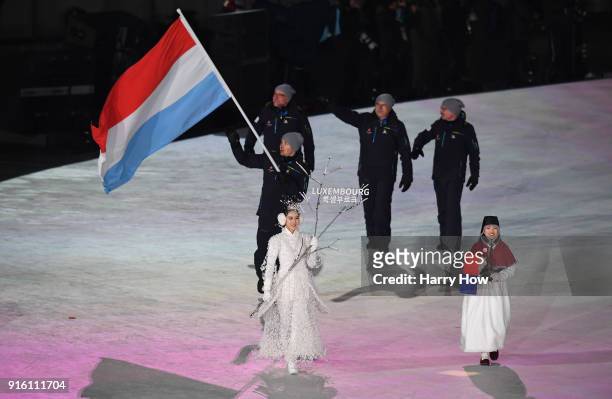Flag bearer Mattheiu Osch of Luxembourg leads the team during the Opening Ceremony of the PyeongChang 2018 Winter Olympic Games at PyeongChang...