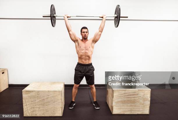 fitness man weightlifting in the gym - snatch weightlifting stock pictures, royalty-free photos & images