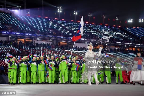 Flag bearer Veronika Velez-Zuzulova of Slovakia and teammates enter the stadium during the Opening Ceremony of the PyeongChang 2018 Winter Olympic...
