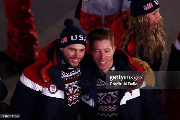 Snowboarder, Shaun White and Freestyle skiier Gus Kenworthy of The United States and teammates enter the stadiumduring the Opening Ceremony of the...