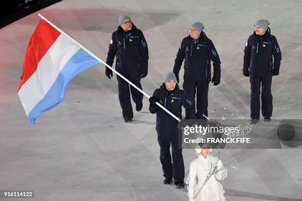 Luxembourg's flagbearer Matthieu Osch leads his delegation as they parade during the opening ceremony of the Pyeongchang 2018 Winter Olympic Games at...