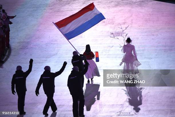 Luxembourg's flagbearer Matthieu Osch leads his delegation as they parade during the opening ceremony of the Pyeongchang 2018 Winter Olympic Games at...