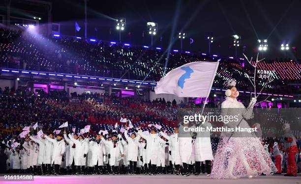 The North Korea and South Korea Olympic teams enter together under the Korean Unification Flag during the Parade of Athletes during the Opening...