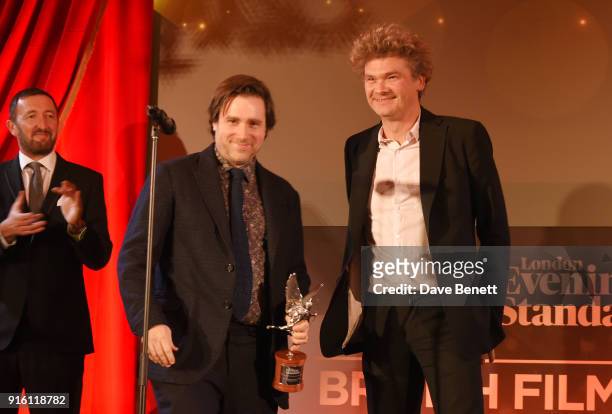 Paul King and Simon Farnaby accept the Peter Sellers Award for Comedy for "Paddington 2" as Ralph Ineson looks on at the London Evening Standard...