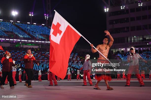 Flag bearer Pita Taufatofua of Tonga leads his country out during the Opening Ceremony of the PyeongChang 2018 Winter Olympic Games at PyeongChang...