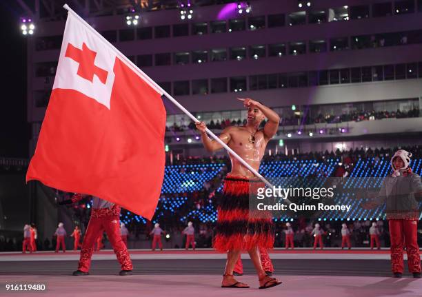 Flag bearer Pita Taufatofua of Tonga leads his country out during the Opening Ceremony of the PyeongChang 2018 Winter Olympic Games at PyeongChang...