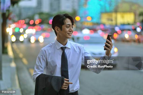 businessman using smartphone outdoors - touching car stock pictures, royalty-free photos & images