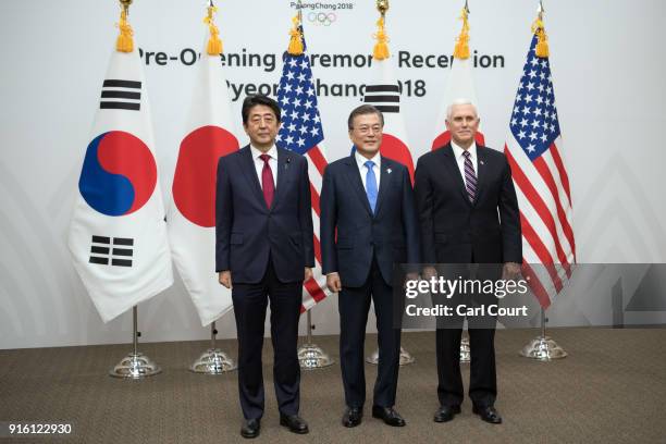 United States Vice President Mike Pence , Japan's Prime Minister, Shinzo Abe and South Korea's President Moon Jae-in pose for photographs during a...