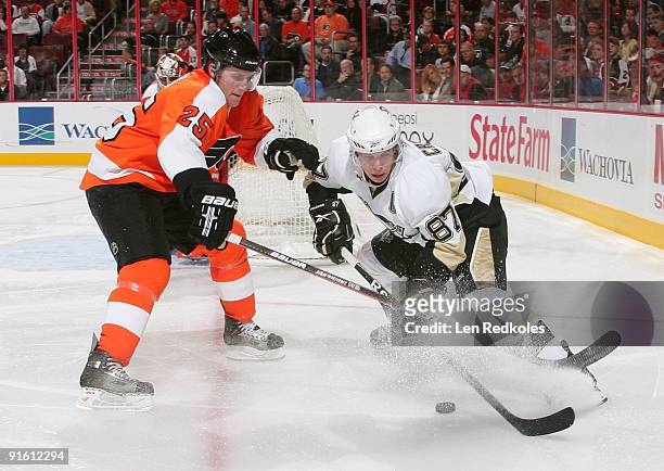 Matt Carle of the Philadelphia Flyers defends against Sidney Crosby of the Pittsburgh Penguins on October 8, 2009 at the Wachovia Center in...