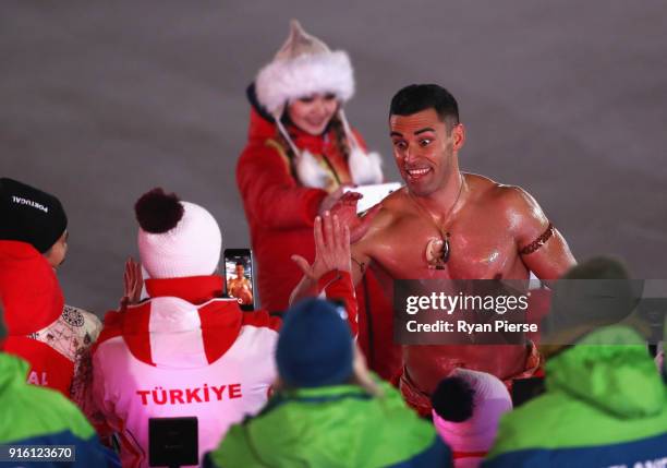 Flag bearer Pita Taufatofua of Tonga leads the team during the Opening Ceremony of the PyeongChang 2018 Winter Olympic Games at PyeongChang Olympic...