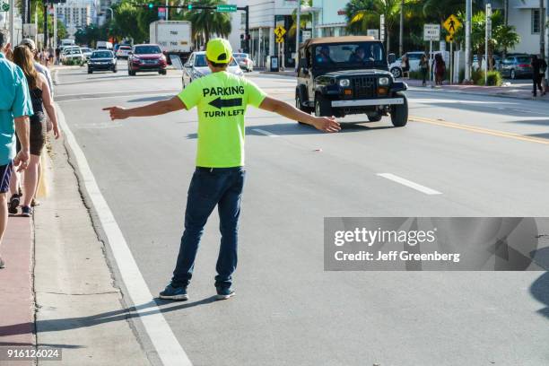 Miami Beach, Parking Lot Attendant Guiding Customers.