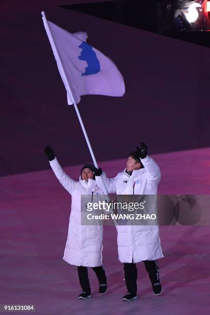 Unified Korea's flagbearers Hwang Chung Gum and Won Yun-jong lead the delegation during the opening ceremony of the Pyeongchang 2018 Winter Olympic...