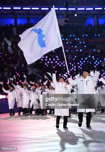 Joint Flag bearers Chung Guam Hwang of Democratic People's Republic of Korea and Yunjong Won of Republic of Korea during the Opening Ceremony of the...