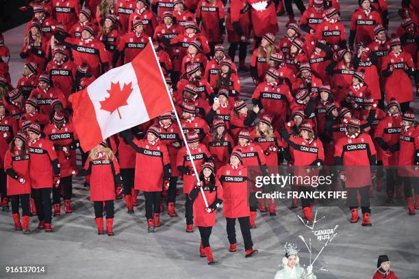 Canada's flagbearer Tessa Virtue leads her delegation during the opening ceremony of the Pyeongchang 2018 Winter Olympic Games at the Pyeongchang...