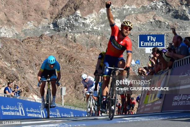 World Tour team BahrainMerida's Italian rider Sonny Colbrelli celebrates his victory as he crosses the finish line during the fourth stage of the...