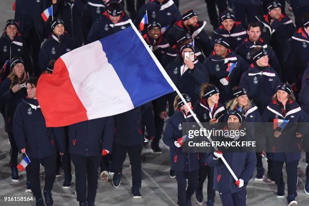 Frances flagbearer Martin Fourcade leads his delegation during the opening ceremony of the Pyeongchang 2018 Winter Olympic Games at the Pyeongchang...