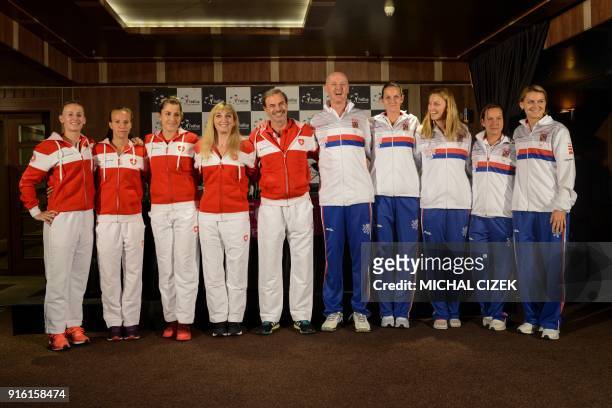 Swiss Fed Cup team players Jil Teichmann, Viktorija Golubic, Belinda Bencic, Timea Bacsinszky, and team captain Heinz Guenthardt pose next to Czech...