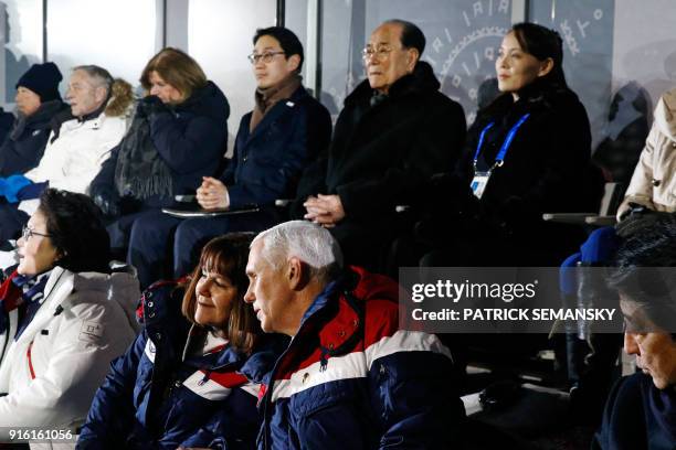 Japan's Prime Minister Shinzo Abe sits beside US Vice President Mike Pence and Pence's wife Karen as they watch the opening ceremony of the...