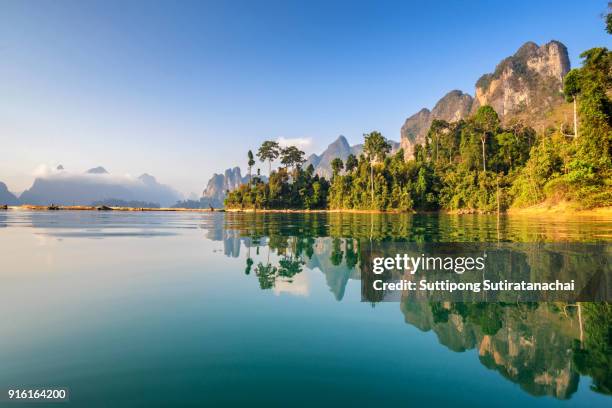 beautiful morning of mountains lake river sky and natural attractions in ratchaprapha dam at khao sok national park, surat thani province, thailand. - surat thani province stock-fotos und bilder