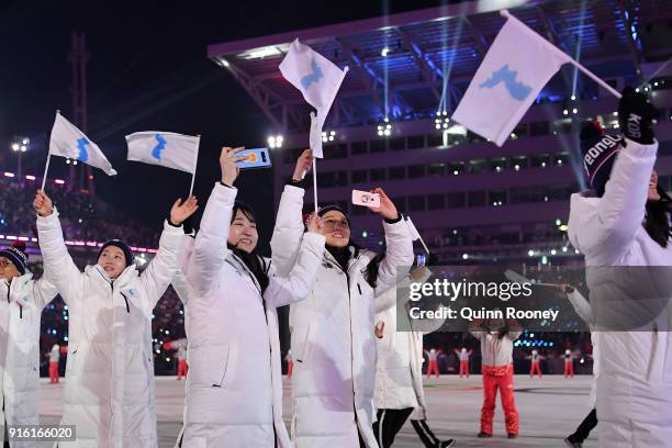 The North Korea and South Korea Olympic teams enter together under the Korean Unification Flag during the Parade of Athletes during the Opening...