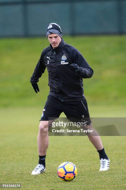 Ciaran Clark passes the ball during the Newcastle United Training session at The Newcastle United Training Centre on February 9 in Newcastle upon...