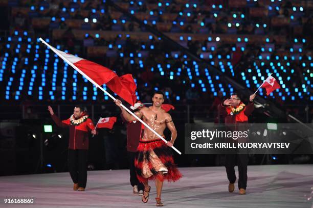 Tonga's flagbearer Pita Taufatofua leads his country's delegation during the opening ceremony of the Pyeongchang 2018 Winter Olympic Games at the...