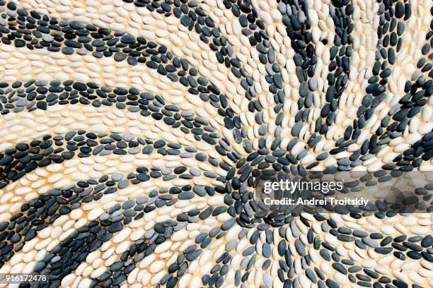 abstract picture of the sun made of pebble stones, rhodes, greece - mosaic greek stock pictures, royalty-free photos & images