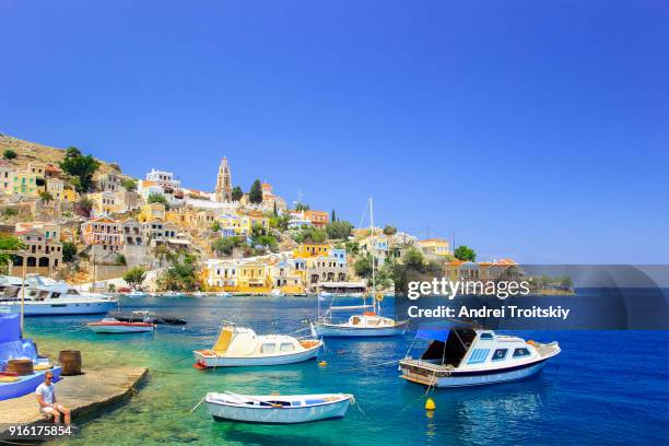 fishing boats in symi harbour, greece - dodecanese islands stock-fotos und bilder