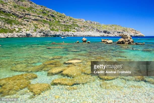 view of anthony quinn bay near faliraki village, rhodes, greece - anthony quinn bay stock pictures, royalty-free photos & images