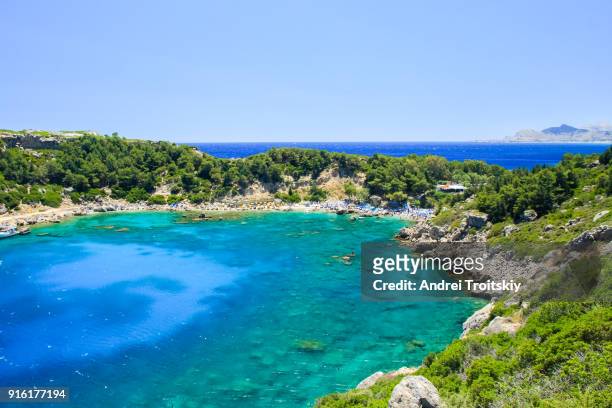 view of anthony quinn bay near faliraki village, rhodes, greece - anthony quinn bay stock pictures, royalty-free photos & images