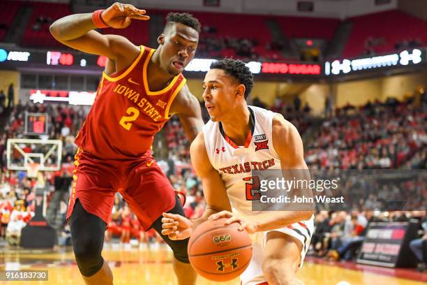 Zhaire Smith of the Texas Tech Red Raiders handles the ball against Cameron Lard of the Iowa State Cyclones during the game on February 7, 2018 at...