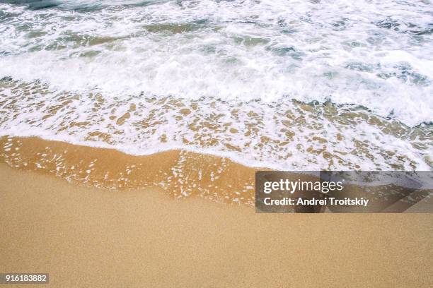 waves at the shore of mediterranean sea near prasonisi, rhodes, greece - stack of sun lounges stock pictures, royalty-free photos & images