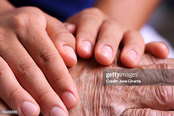 hands taking care - hand massage stock pictures, royalty-free photos & images