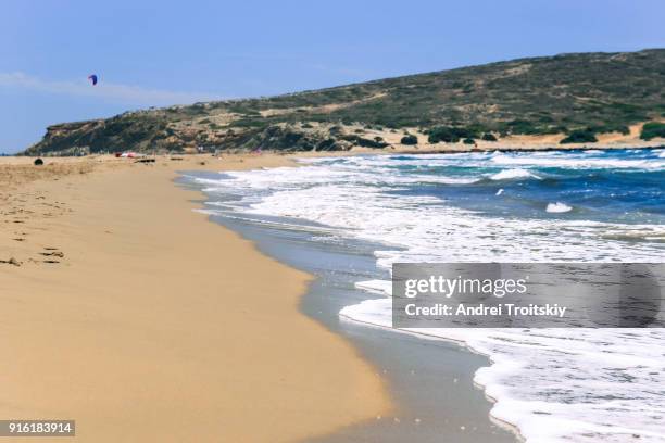 waves at the shore of mediterranean sea viewed from prasonisi beach, rhodes, greece - kite lagoon stock pictures, royalty-free photos & images